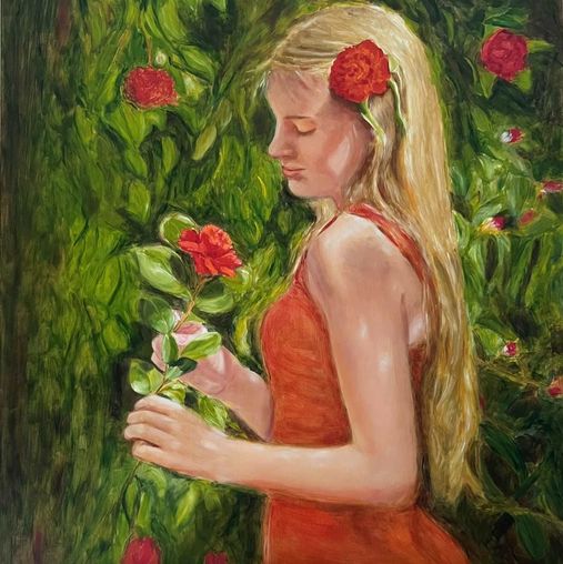 Romantic young girl with beautiful Camellia flower 